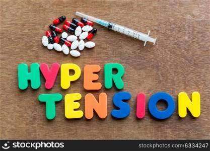 hypertension colorful word in the wooden background