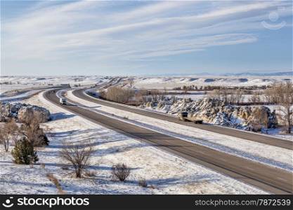I-25 freeway in winter scenery at Natural Fort geological landmark in northern Colorado near Wyoming border