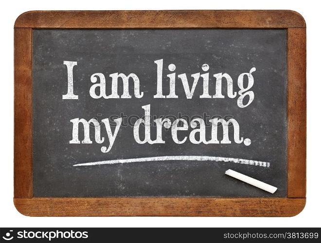 I am living my dream - positive affirmation words on a vintage slate blackboard