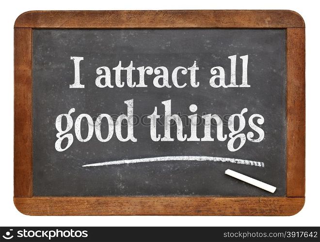 I attract all good things - positive affirmation words on a vintage slate blackboard