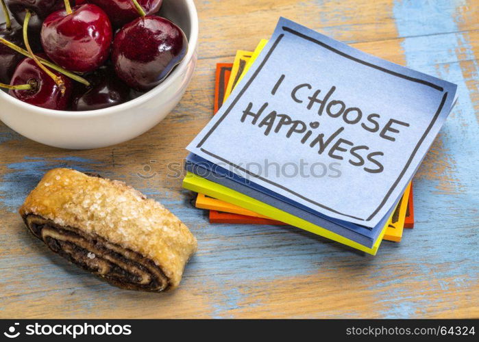 I choose happiness positive affirmation - handwriting on a sticky note with cherries and cookie