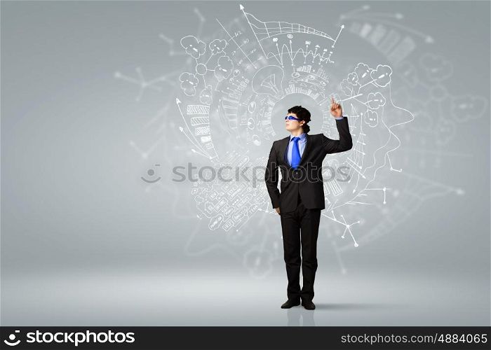 I have idea. Image of young businessman wearing goggles. Idea concept