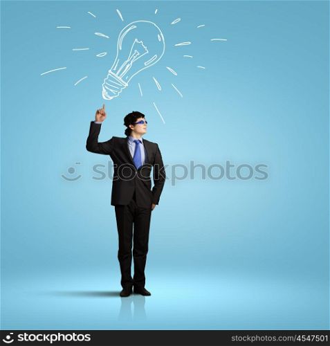 I have idea. Image of young businessman with light bulb. New idea and inspiration