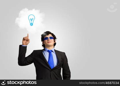 I have idea. Image of young businessman with light bulb. New idea and inspiration