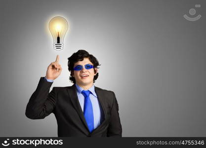 I have idea. Image of young businessman with light bulb. New idea and inspiration