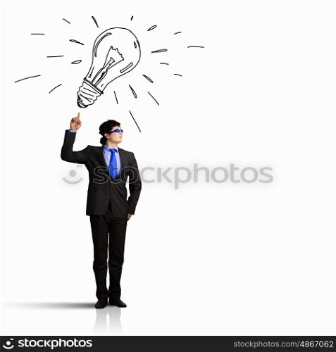 I have idea. Image of young businessman with light bulb. New idea and inspiration