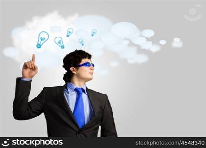 I have idea. Image of young businessman with light bulbs. New idea and inspiration