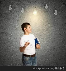I have idea. School boy and electric bulbs hanging above