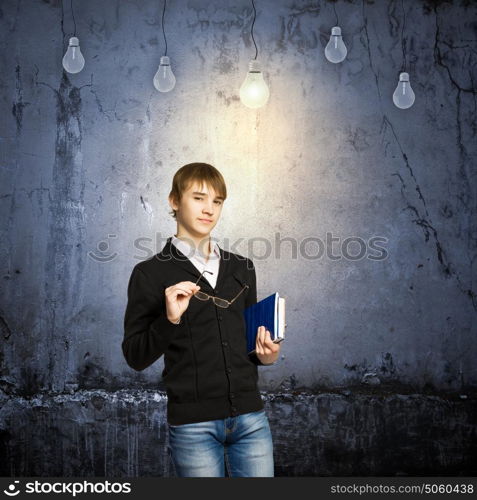 I have idea. School boy and electric bulbs hanging above