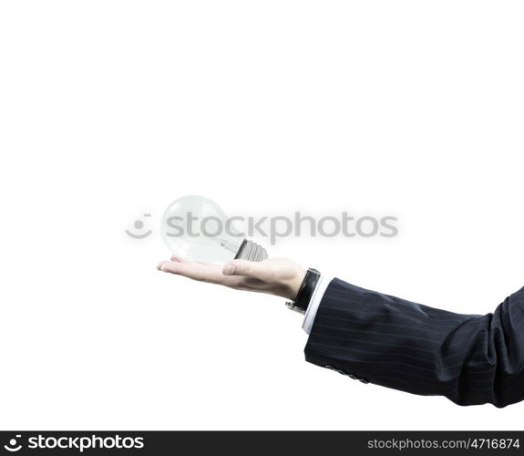 I have interesting idea. Businessman hand holding light bulb in palm