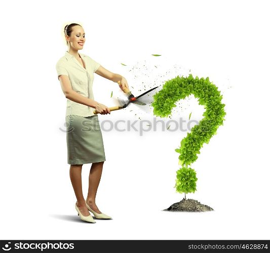 I have question. Young businesswoman cutting plant shaped like question mark