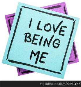 I love being me - positive affirmation - handwriting on an isolated sticky note