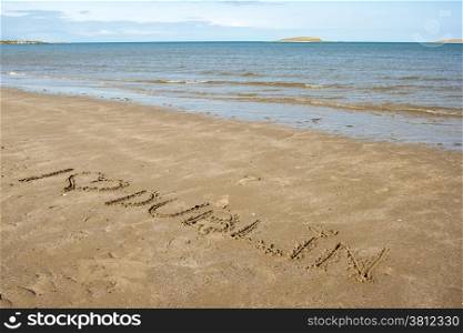 I love Dublin written on the sand in a beach