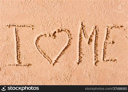 I love me written on wet sand