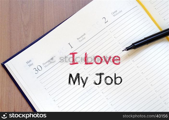 I love my job text concept write on notebook