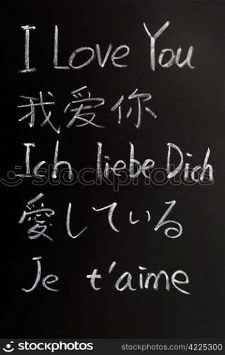 I love you - written with chalk in various languages on a blackboard