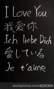 I love you - written with chalk in various languages on a blackboard