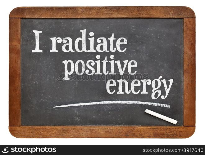 I radiate positive energy - positive affirmation words on a vintage slate blackboard