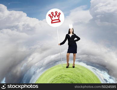 I&rsquo;m a queen! Watch out!. Young businesswoman in paper crown and sign in hands