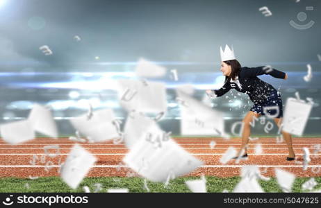 I&rsquo;m a queen! Watch out!. Young businesswoman in paper crown running in a hurry