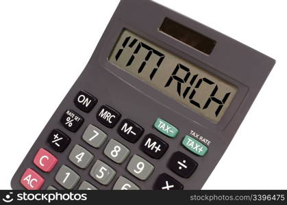 I&rsquo;m rich written on display of an old calculator on white background in perspective