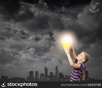 I&rsquo;ve got an idea!. Cute girl with bucket and light bulb in it