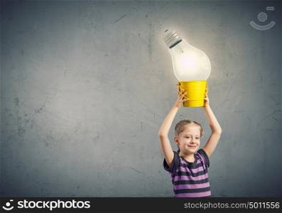 I&rsquo;ve got an idea!. Cute girl with bucket and light bulb in it