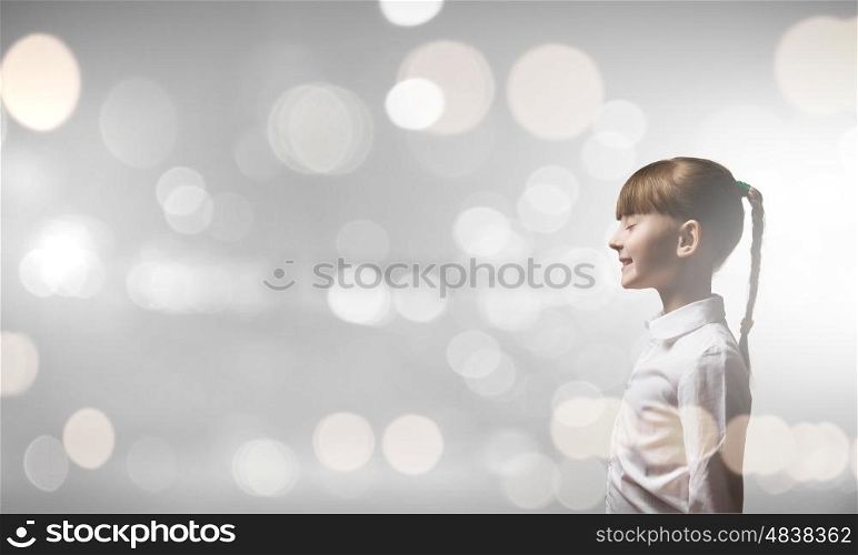 I wish............ Side view of girl with closed eyes against bokeh background
