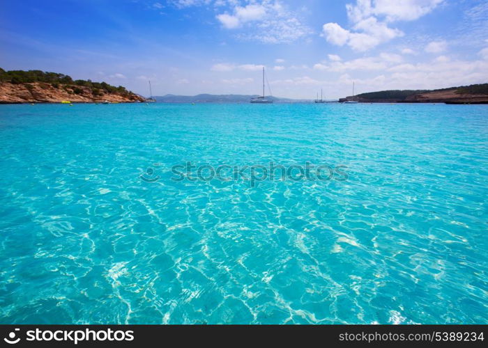 Ibiza Cala Bassa beach with turquoise Mediterranean sea at Balearic Islands