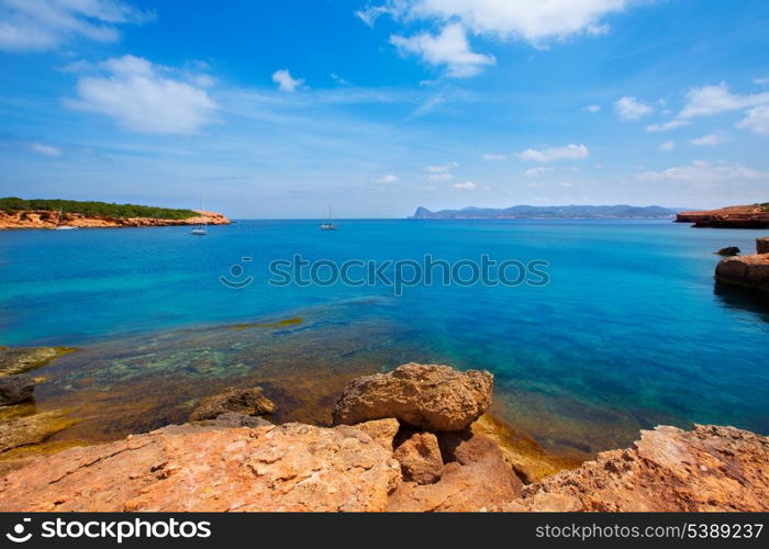 Ibiza Cala Bassa beach with turquoise Mediterranean sea at Balearic Islands