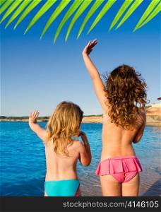 Ibiza Cala Conta beach little girls greeting hand sign saying bye
