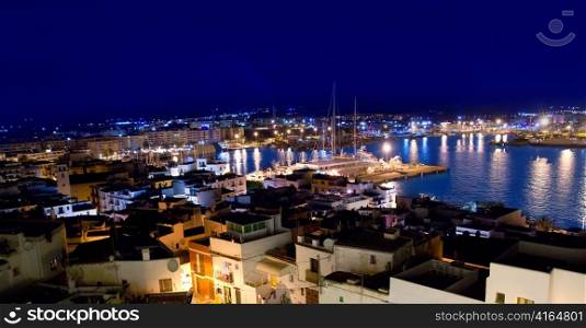 Ibiza downtown eivissa high angle night view with blue mediterranean sea