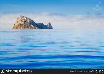 Ibiza Es Vedra island in calm blue Mediterranean water