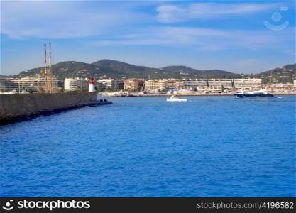 Ibiza Lighthouse and dock with boats in Mediterranean Spain