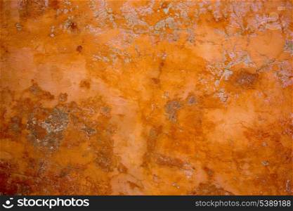 Ibiza mediterranean wall textures in orange concrete wall