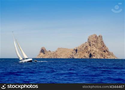 Ibiza sailboat in Es Vedra island at Mediterranean blue sea
