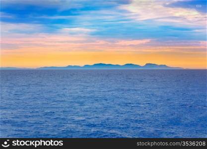 Ibiza sunset in Balearic islands view from Mediterranean sea