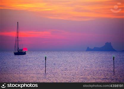 Ibiza sunset sun view from formentera Island with sailboat in Balearic Islands