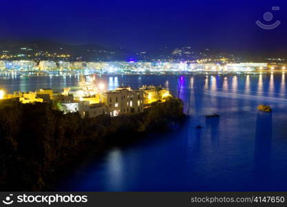 Ibiza town port blue sea night lights of Eivissa city