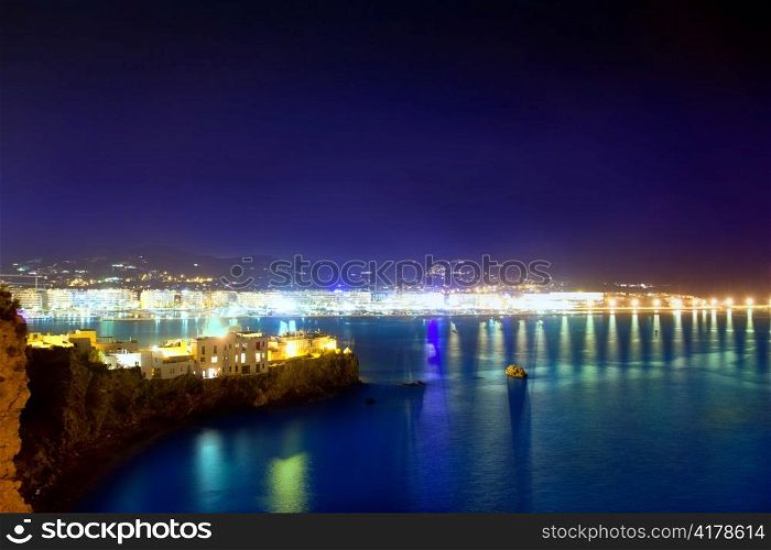 Ibiza town port blue sea night lights of Eivissa city