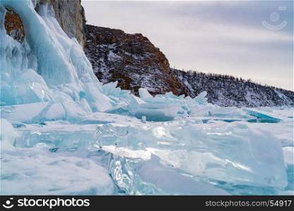 Ice blocks covered with snow at Frozen Lake Baikal in Russia