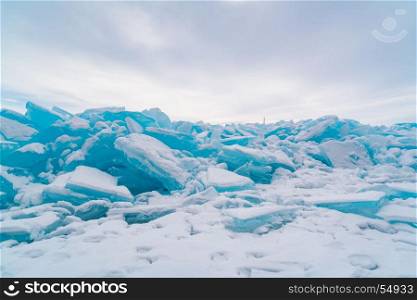 Ice blocks covered with snow in Lake Baikal in winter