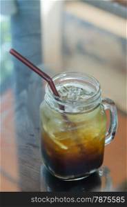 ice coffee. A glass of black iced coffee with drinking Straw