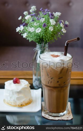 Ice coffee and young coconut cake with fresh cream and red grape. sweet dessert