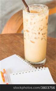 Ice coffee latte on wooden table, stock photo