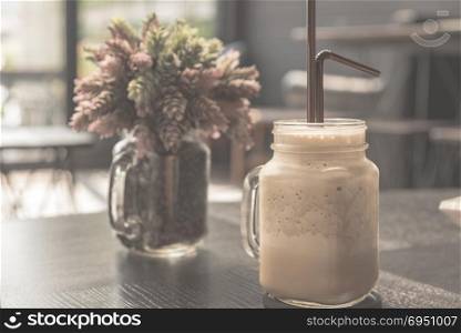 Ice coffee on table, vintage filtered Images