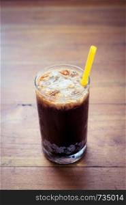 Ice coffee on wooden background