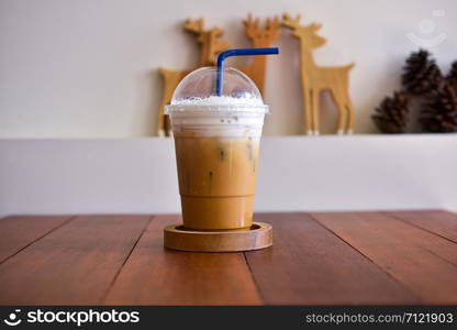 Ice coffee on wooden table in coffee shop