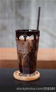 Ice coffee on wooden table, stock photo