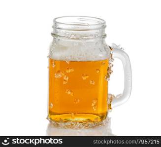 Ice cold amber beer in jar glass. Isolated on white background with reflection.